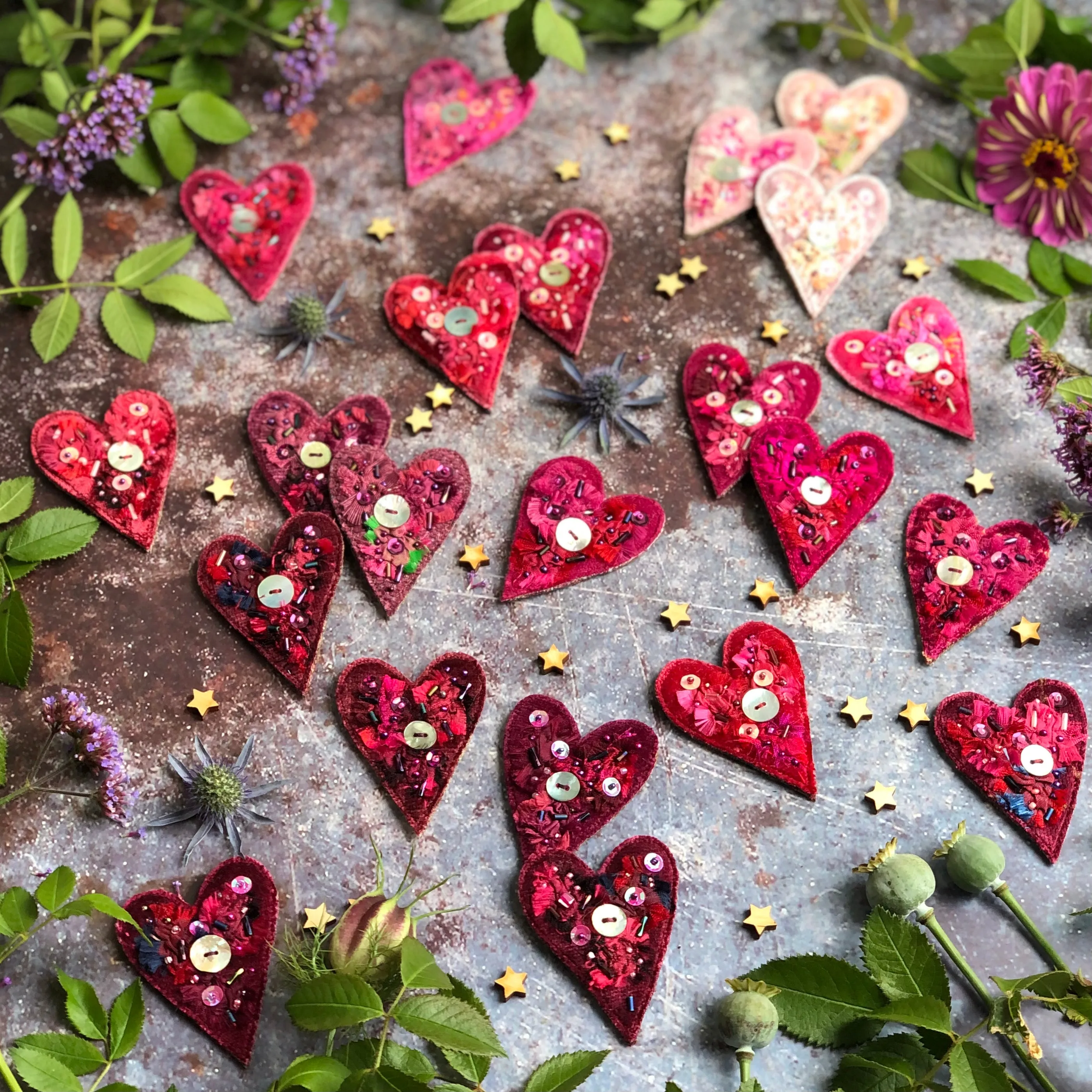 Fabric heart brooches in pinks