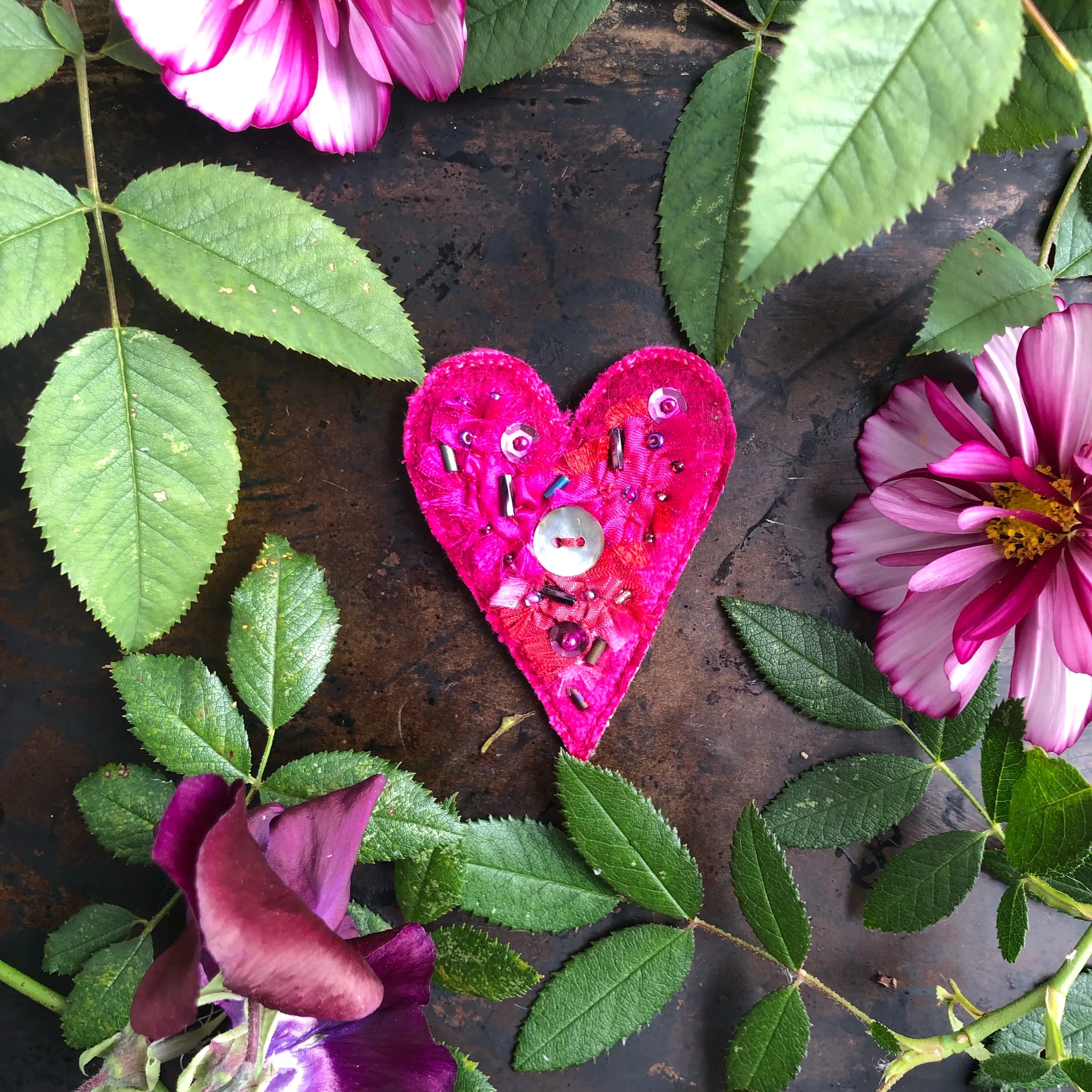 Fabric heart brooches in pinks